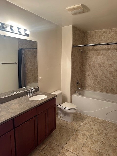 full bathroom with tiled shower / bath combo, vanity, tile patterned flooring, and toilet