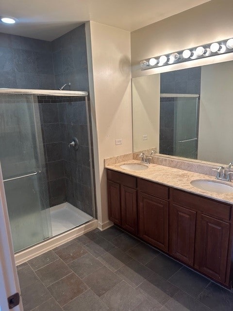 bathroom featuring vanity and an enclosed shower