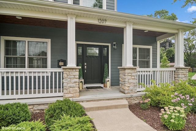 doorway to property with a porch