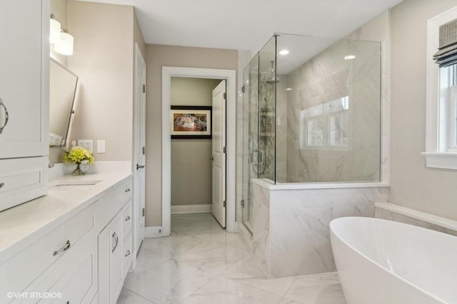 bathroom with vanity and separate shower and tub