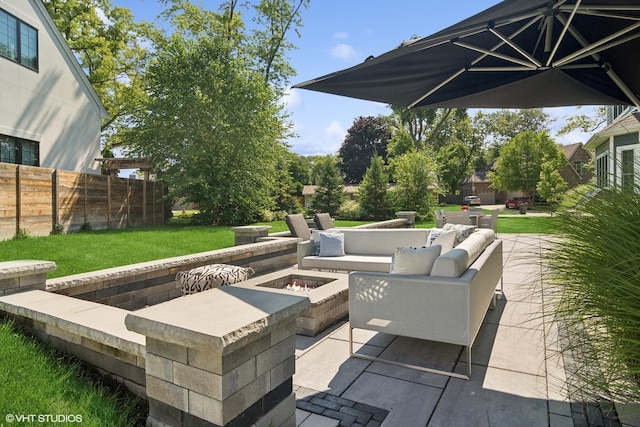 view of patio / terrace featuring an outdoor living space with a fire pit