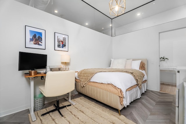 bedroom with parquet floors and a chandelier