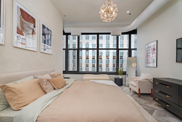 bedroom featuring light parquet flooring and an inviting chandelier