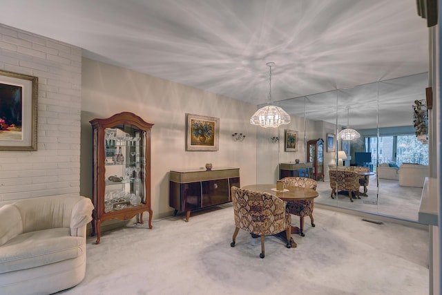 2 Oak Brook Club Dr Unit B209, Oak Brook, IL 60523 - dining area with carpet flooring and a chandelier