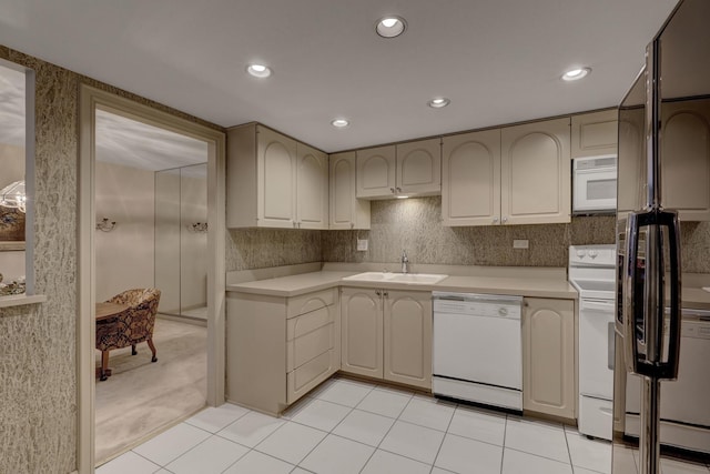 2 Oak Brook Club Dr Unit B209, Oak Brook, IL 60523 - kitchen with a sink, white appliances, light countertops, recessed lighting, and light tile patterned floors