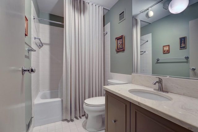 2 Oak Brook Club Dr Unit B209, Oak Brook, IL 60523 - bathroom featuring visible vents, vanity, shower / bath combination with curtain, toilet, and tile patterned floors