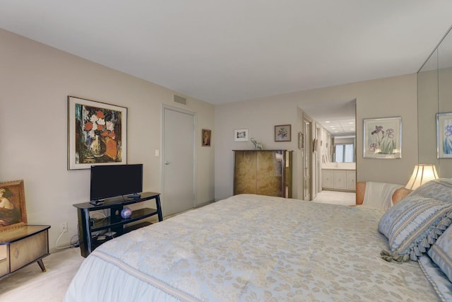 2 Oak Brook Club Dr Unit B209, Oak Brook, IL 60523 - bedroom with light colored carpet, ensuite bath, and visible vents