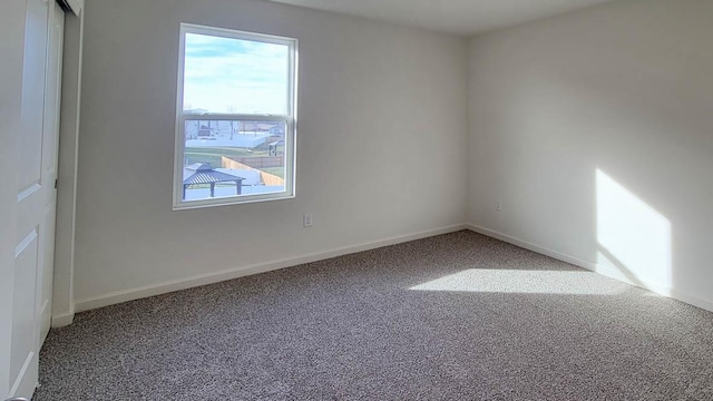 unfurnished room featuring carpet floors