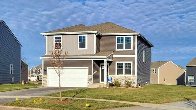 view of front facade featuring a garage and a front lawn