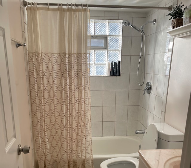 full bathroom featuring vanity, shower / bathtub combination with curtain, and toilet