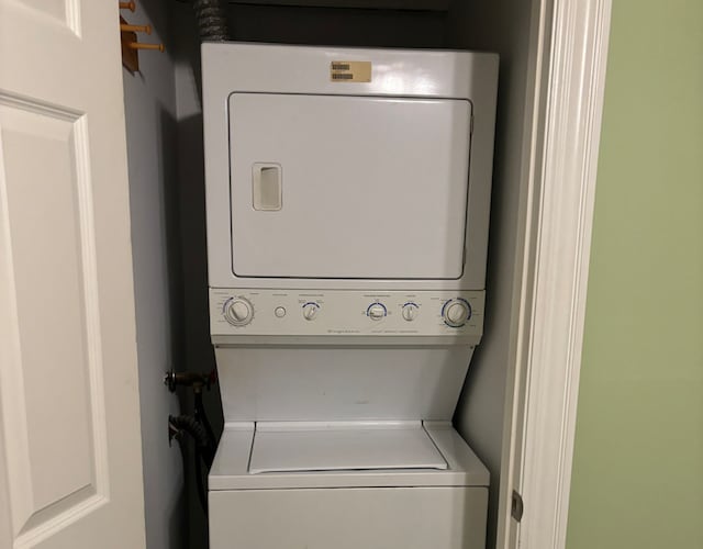 washroom featuring stacked washer and dryer