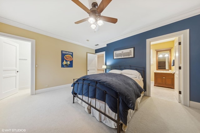 bedroom with crown molding, light colored carpet, ceiling fan, and ensuite bath