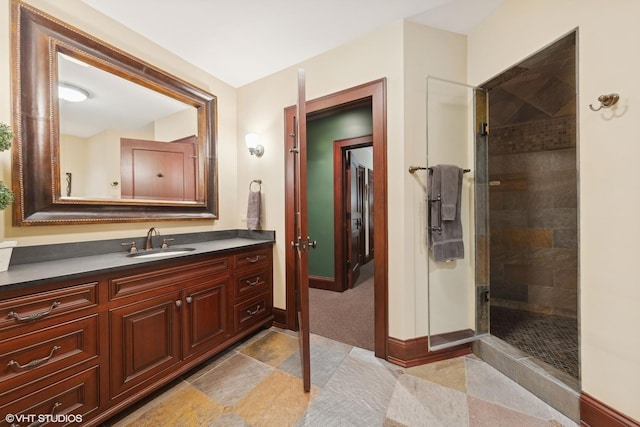 bathroom featuring vanity and a tile shower