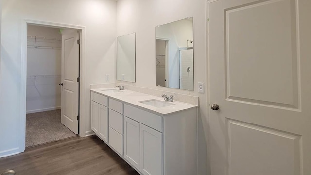 bathroom featuring vanity and hardwood / wood-style floors