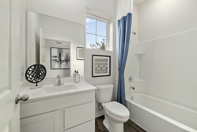 full bathroom with hardwood / wood-style flooring, shower / tub combo with curtain, vanity, and toilet