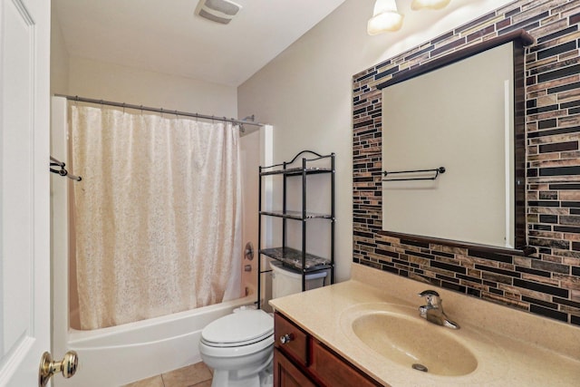 bathroom featuring tile patterned flooring, toilet, shower / tub combo with curtain, decorative backsplash, and vanity