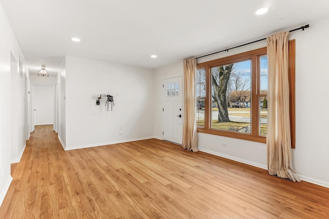 interior space featuring light wood-type flooring and recessed lighting