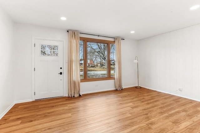 foyer featuring light wood-type flooring, baseboards, and recessed lighting