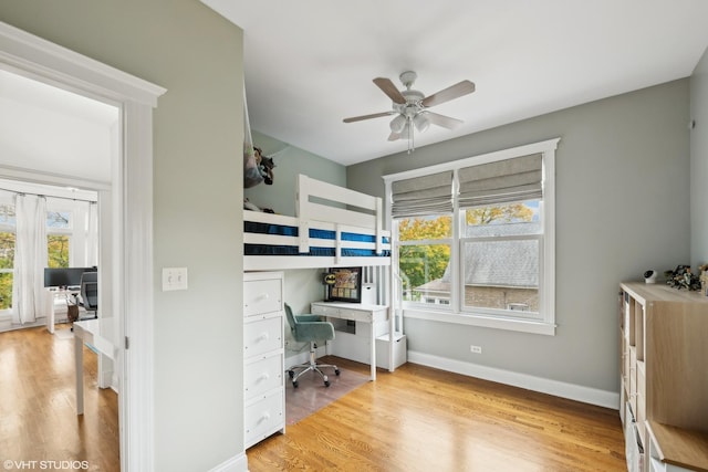 bedroom featuring ceiling fan and light wood-type flooring