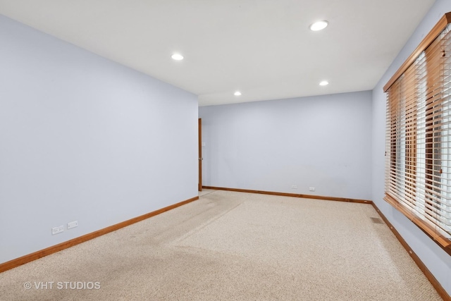 spare room featuring carpet flooring