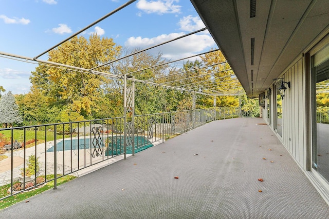 view of patio with a fenced in pool