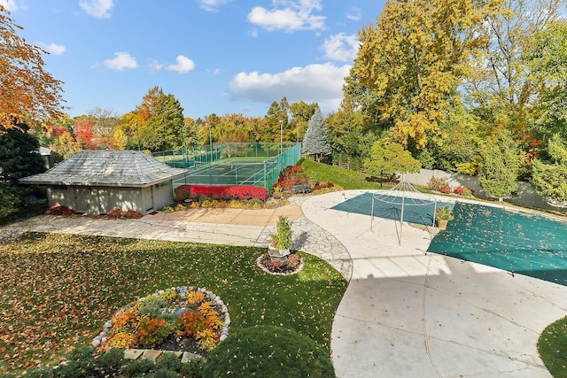 view of swimming pool featuring a patio area and a lawn