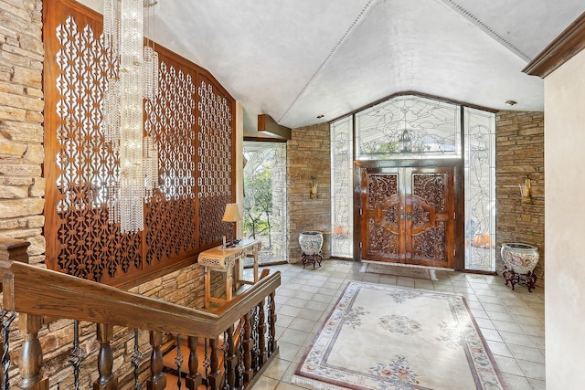 tiled foyer entrance with lofted ceiling