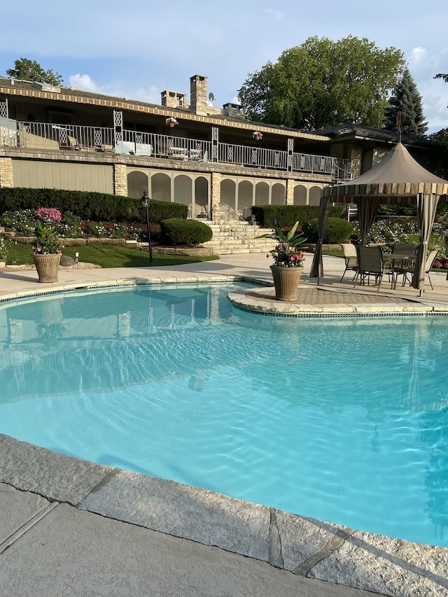 view of pool with a gazebo and a patio area