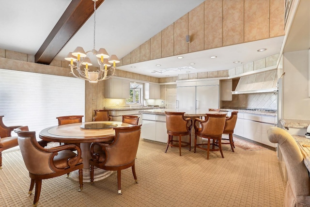 dining area with beamed ceiling, high vaulted ceiling, and a chandelier