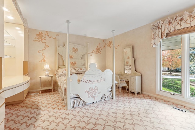 bedroom featuring light colored carpet