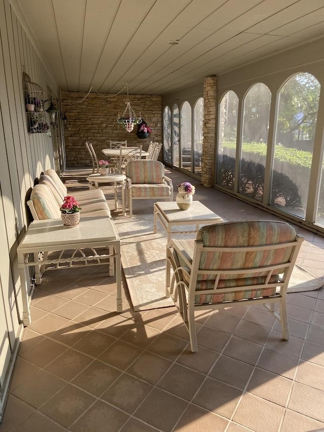 sunroom / solarium featuring wooden ceiling