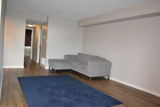 unfurnished living room with dark hardwood / wood-style floors