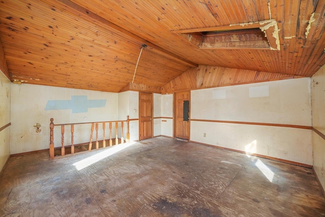 empty room with wood ceiling and lofted ceiling