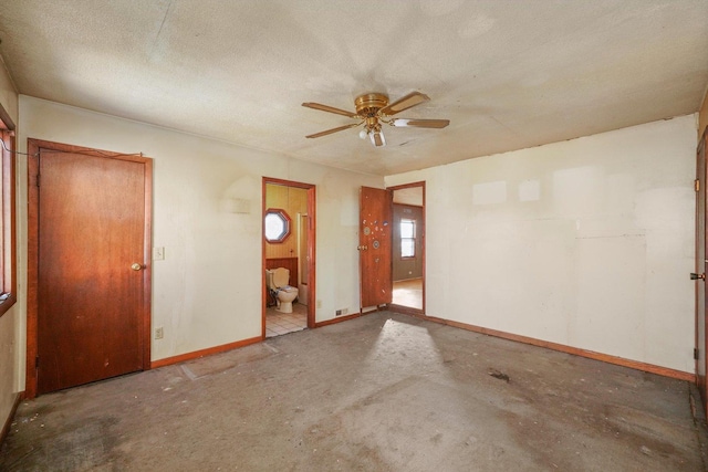 unfurnished room featuring a textured ceiling and ceiling fan