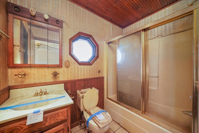 full bathroom with tile patterned floors, toilet, bath / shower combo with glass door, wooden ceiling, and vanity