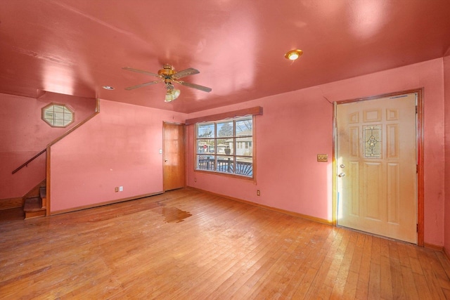 unfurnished living room with ceiling fan and light hardwood / wood-style floors