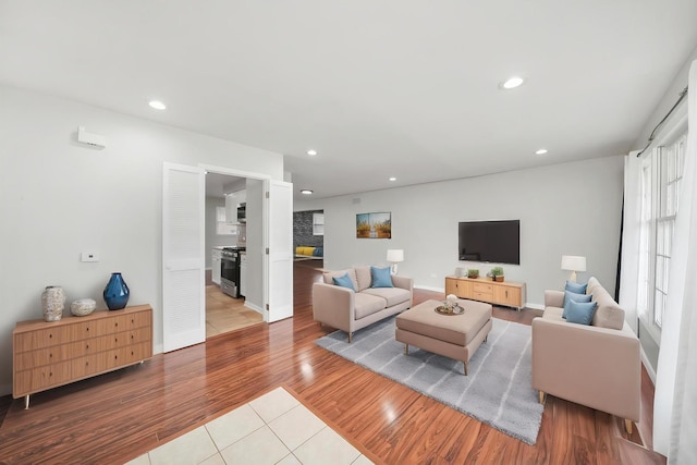 living area with tile patterned flooring and recessed lighting