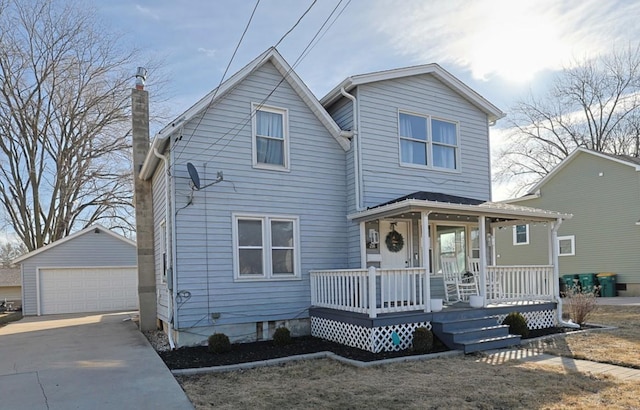 front facade featuring an outbuilding, a garage, and covered porch