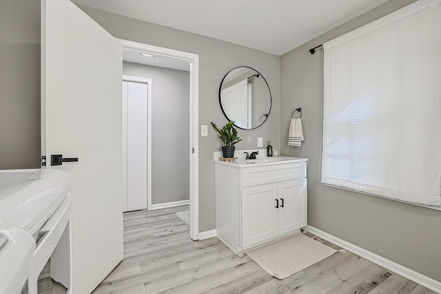 bathroom with vanity and hardwood / wood-style floors