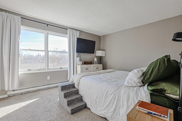 bedroom featuring carpet, a textured ceiling, and baseboard heating