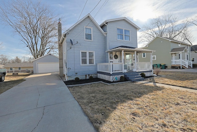 view of property with a garage, a porch, an outbuilding, and a front lawn