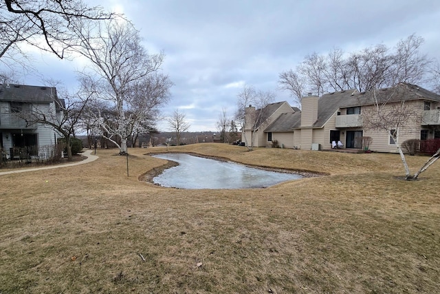 view of pool featuring a yard