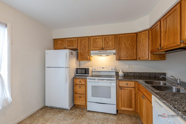 kitchen featuring white appliances and sink