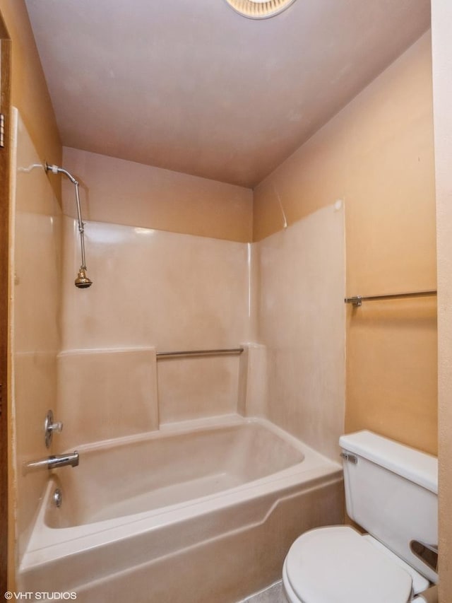 bathroom featuring shower / bathtub combination and toilet