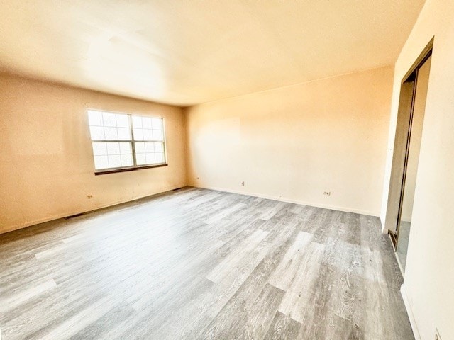 spare room featuring light hardwood / wood-style flooring