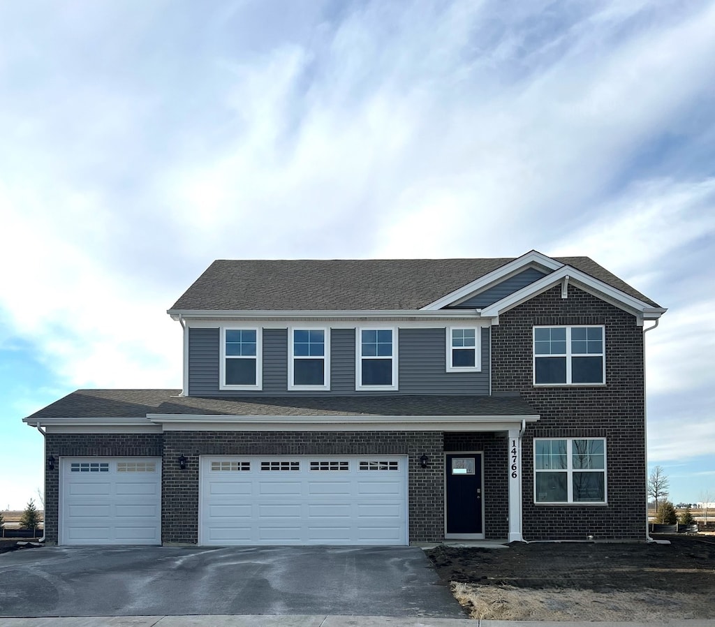 view of front of property featuring a garage