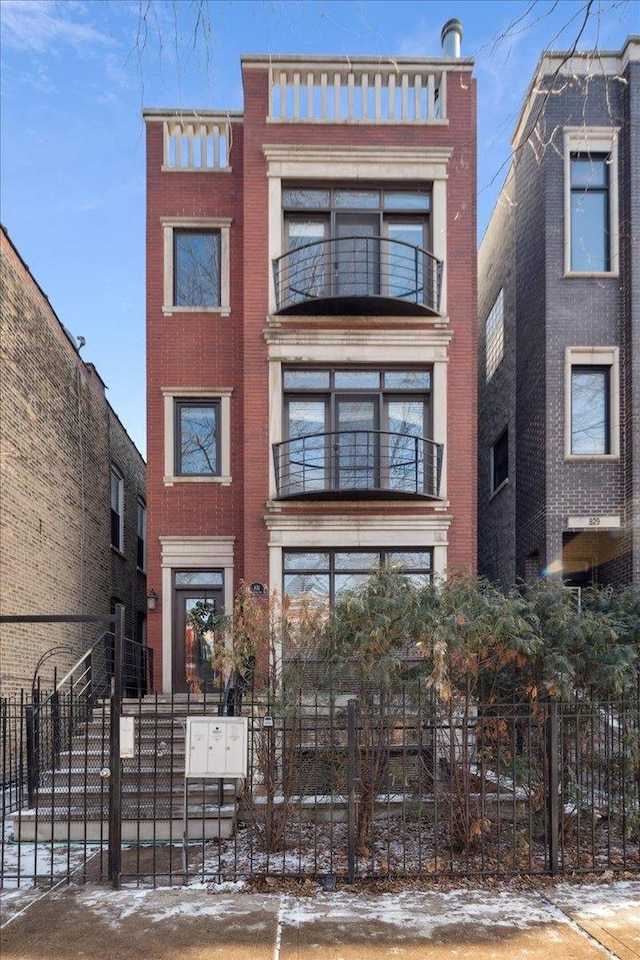 view of front of property with a balcony