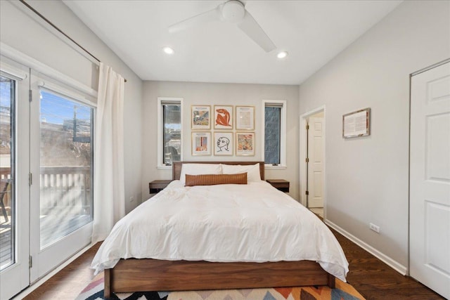 bedroom with ceiling fan, dark hardwood / wood-style floors, and access to outside