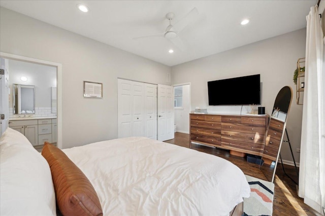 bedroom with ceiling fan, ensuite bath, dark hardwood / wood-style floors, and a closet