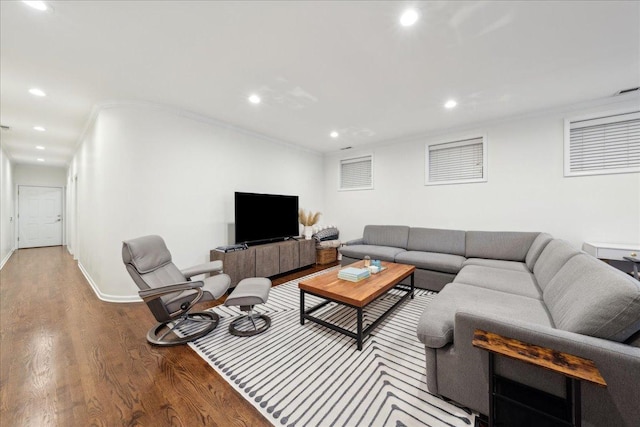 living room featuring hardwood / wood-style flooring and ornamental molding